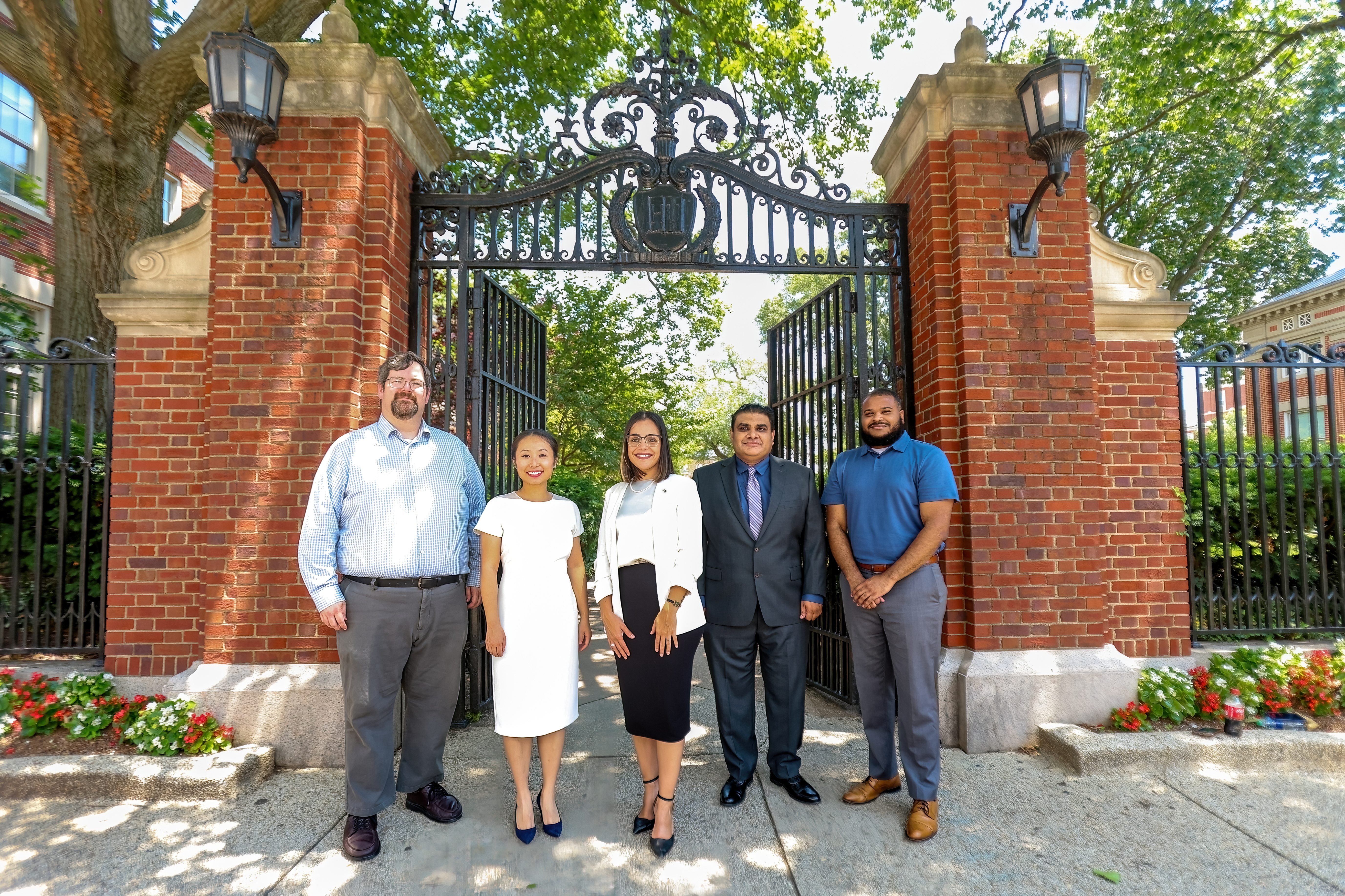 A picture of the ODA team in front of a gate leading to The Yard